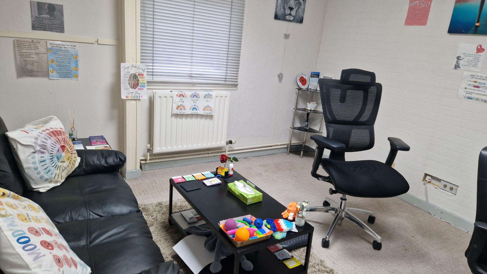 Dawn's counselling room with a comfortable seating area and calming resources